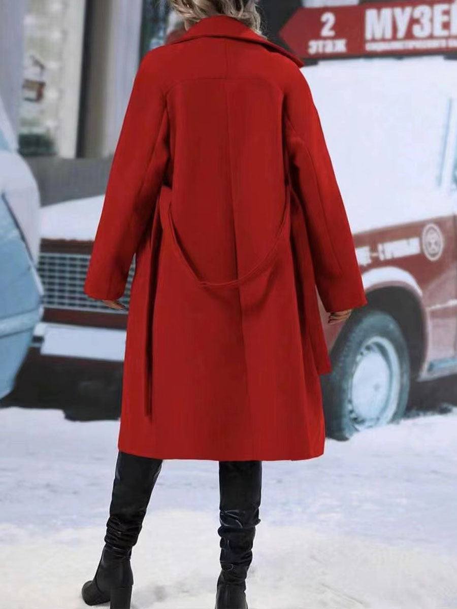 Red double-breasted trench coat with belt, long sleeves, and flip collar.