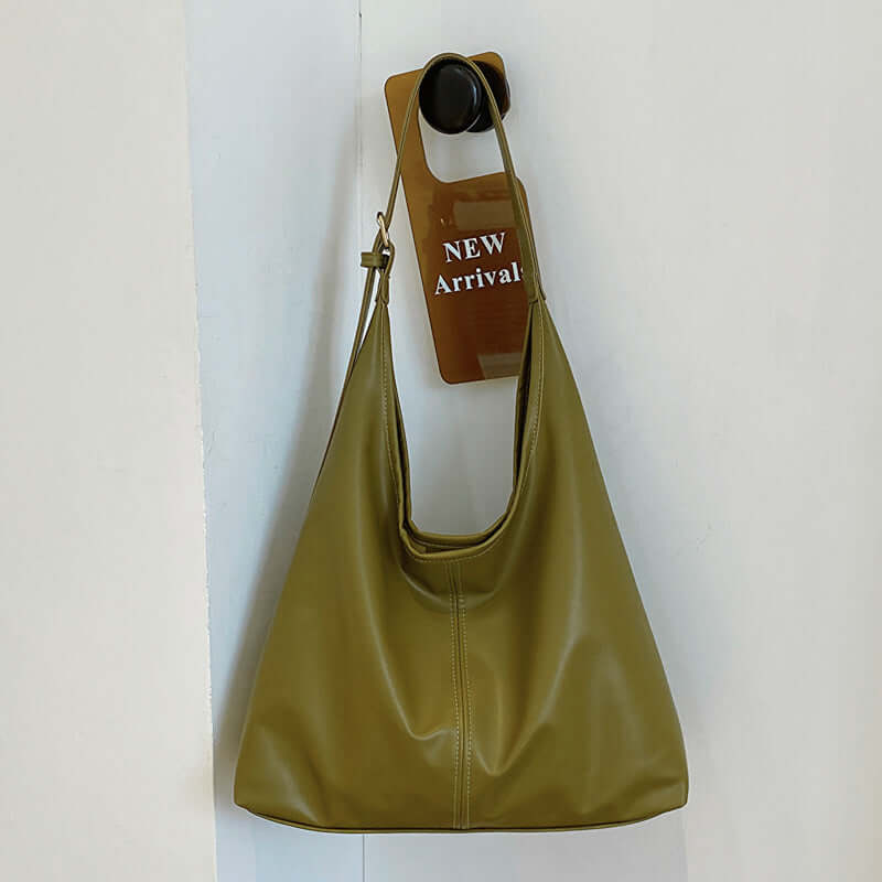 Large capacity green commuter tote for women with synthetic leather material.