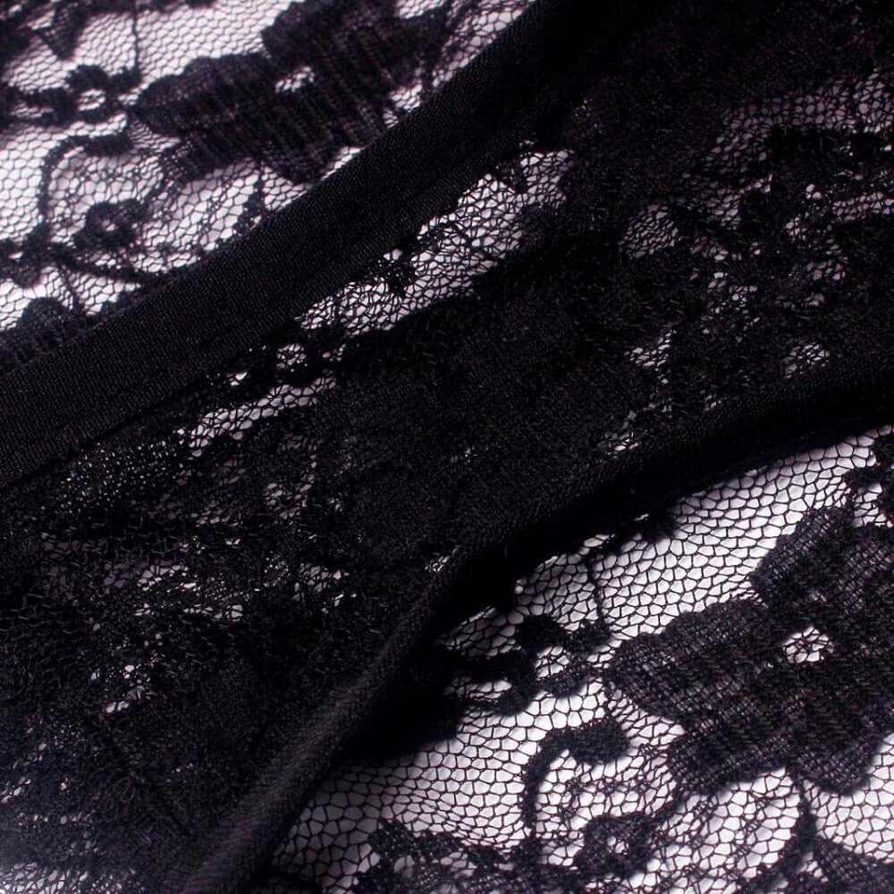 Black lace fabric detail of ladies bra underwear set.