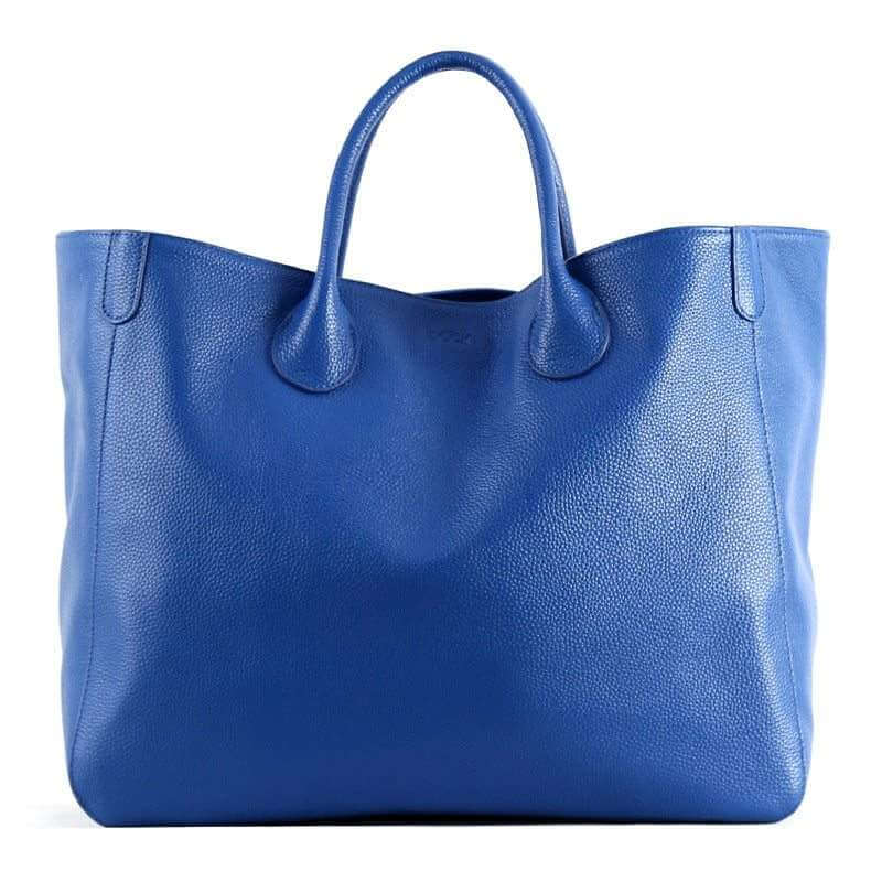 Top layer leather hand-held ladies tote bag in blue with textured cowhide and polyester lining.