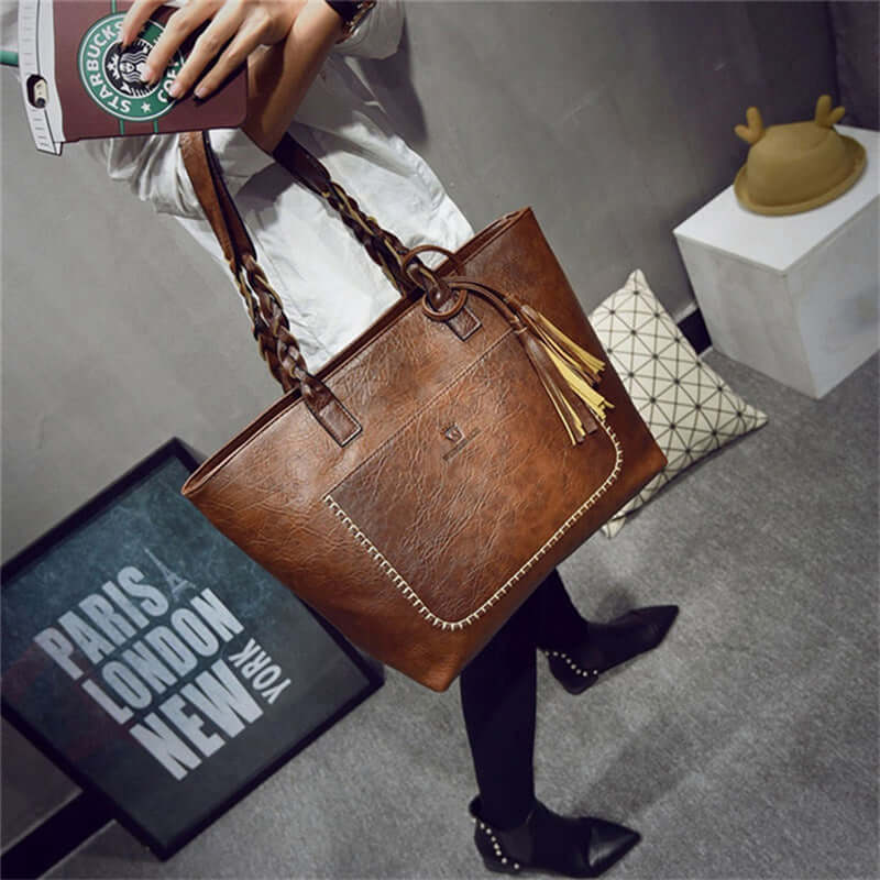 Women's letter hand bag in brown PU leather with braided double straps, featuring various internal pockets.