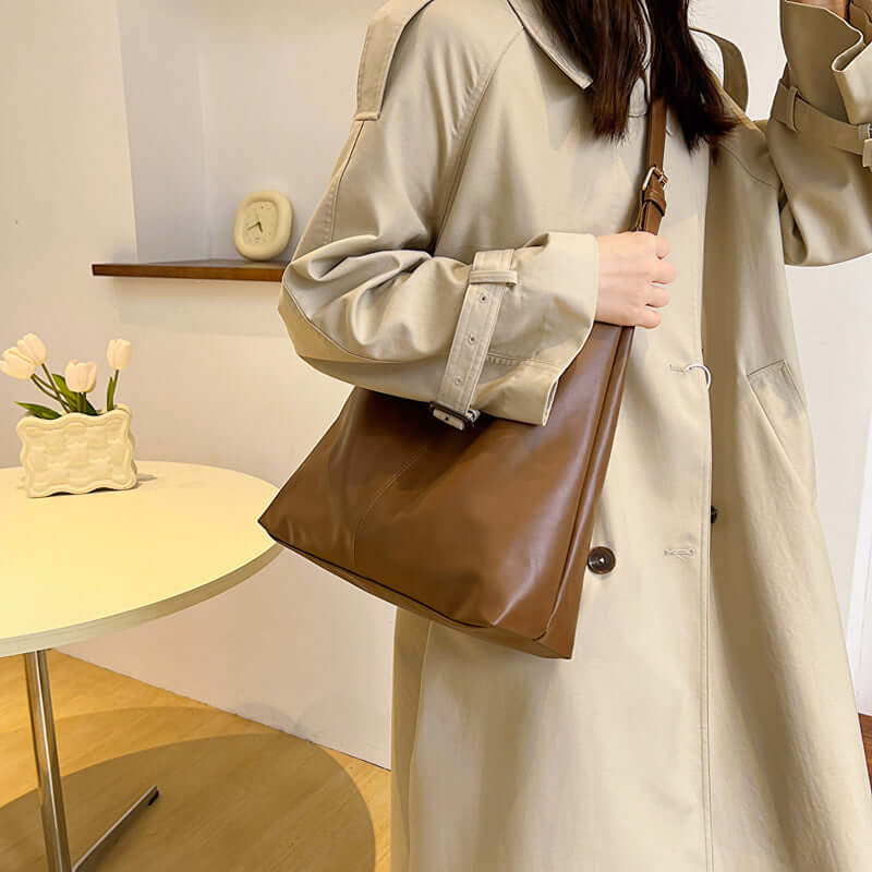 Large capacity commuter tote women's white bag with synthetic leather lining and single shoulder strap, shown in brown.