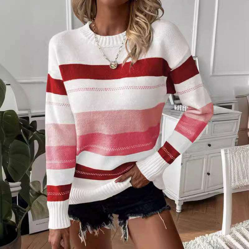 Casual contrast color striped knitted long sleeve sweater in white and red tones.