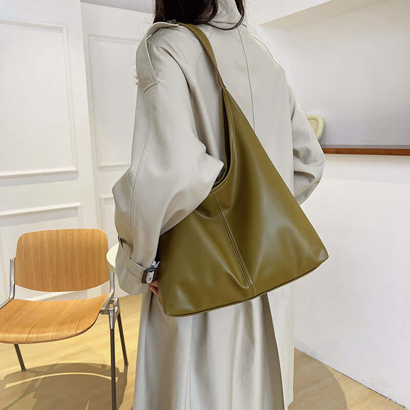 Large capacity commuter tote bag for women in olive green, featuring synthetic leather and a single shoulder strap.