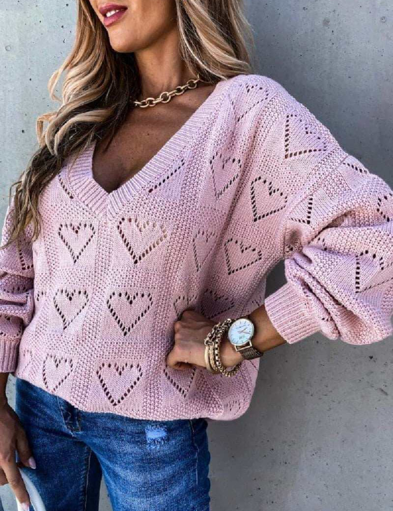 Pink acrylic and spandex hollow knit sweater with heart patterns for women.