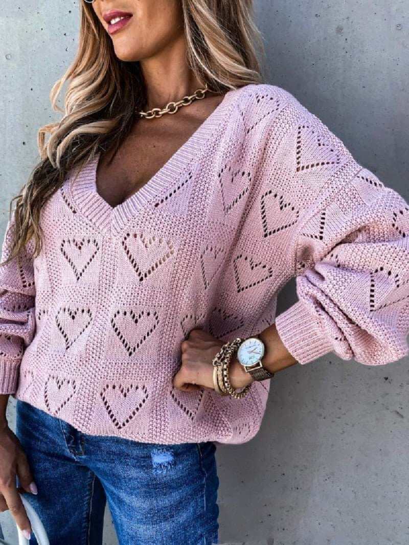 Pink acrylic and spandex hollow knit sweater with heart patterns for women.