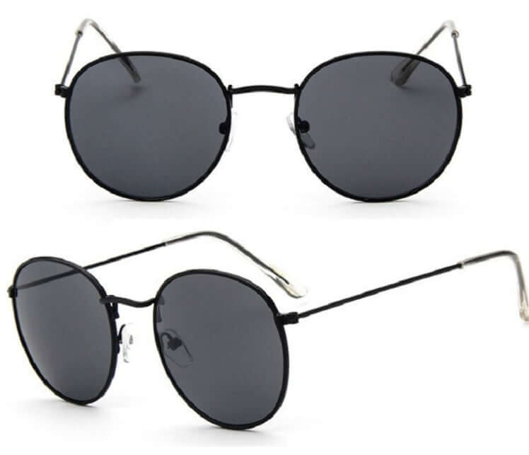 Women retro sunglasses with metal frame and grey lenses.