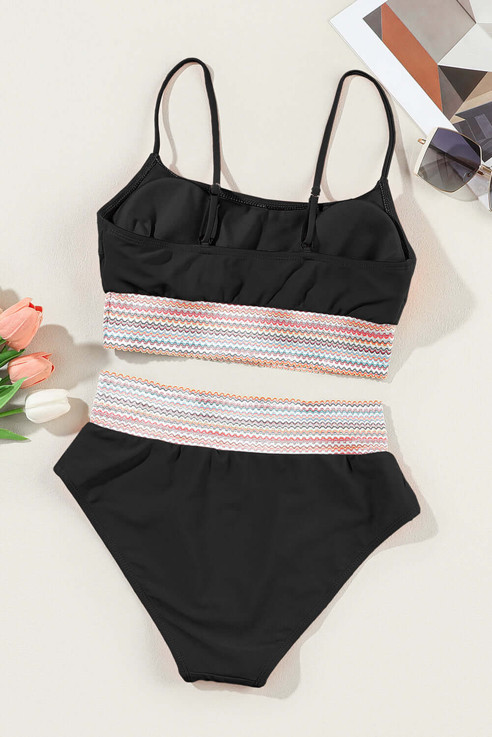 Black striped patchwork spaghetti strap high waist bikini set, trendy and chic for beach or poolside activities.