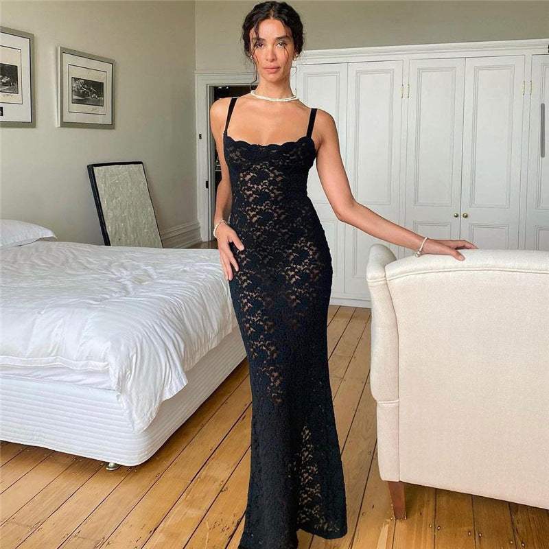 Black off-neck see-through lace slim fit dress in a bedroom setting.