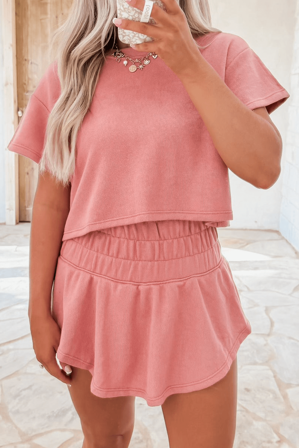 Blossom Cropped Tee and Ruffle High Waist Skort Set in pink, featuring ruffle details for casual elegance.