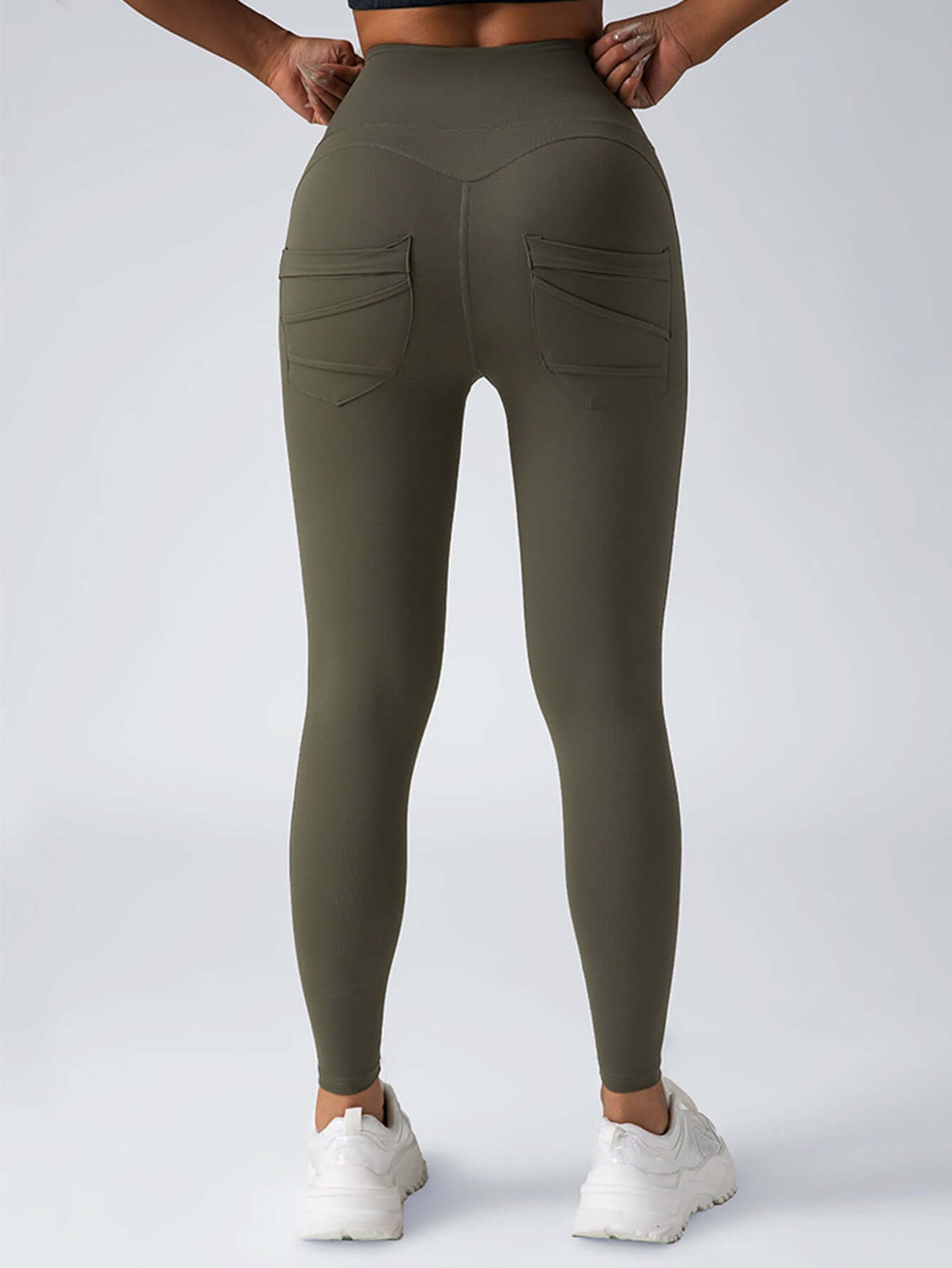 Back view of high-waisted olive green women's yoga leggings with pockets, perfect for workouts and casual wear.