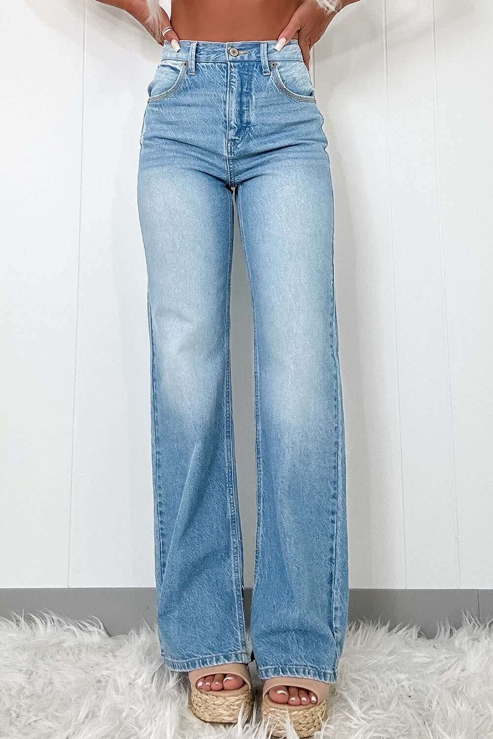 Myosotis ripped high rise slit jeans in light wash, featuring a flattering silhouette and vintage charm.