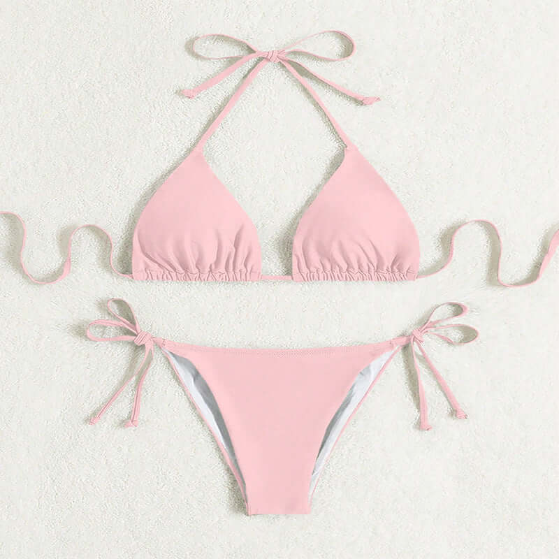 Pink tied halter bikini swimsuit with solid color design for women.