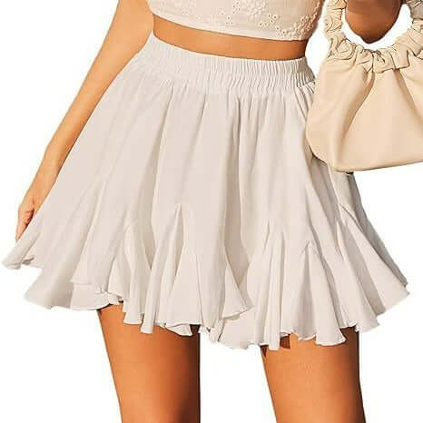 A-line high waist pleated mini skirt in white with elastic waistband.