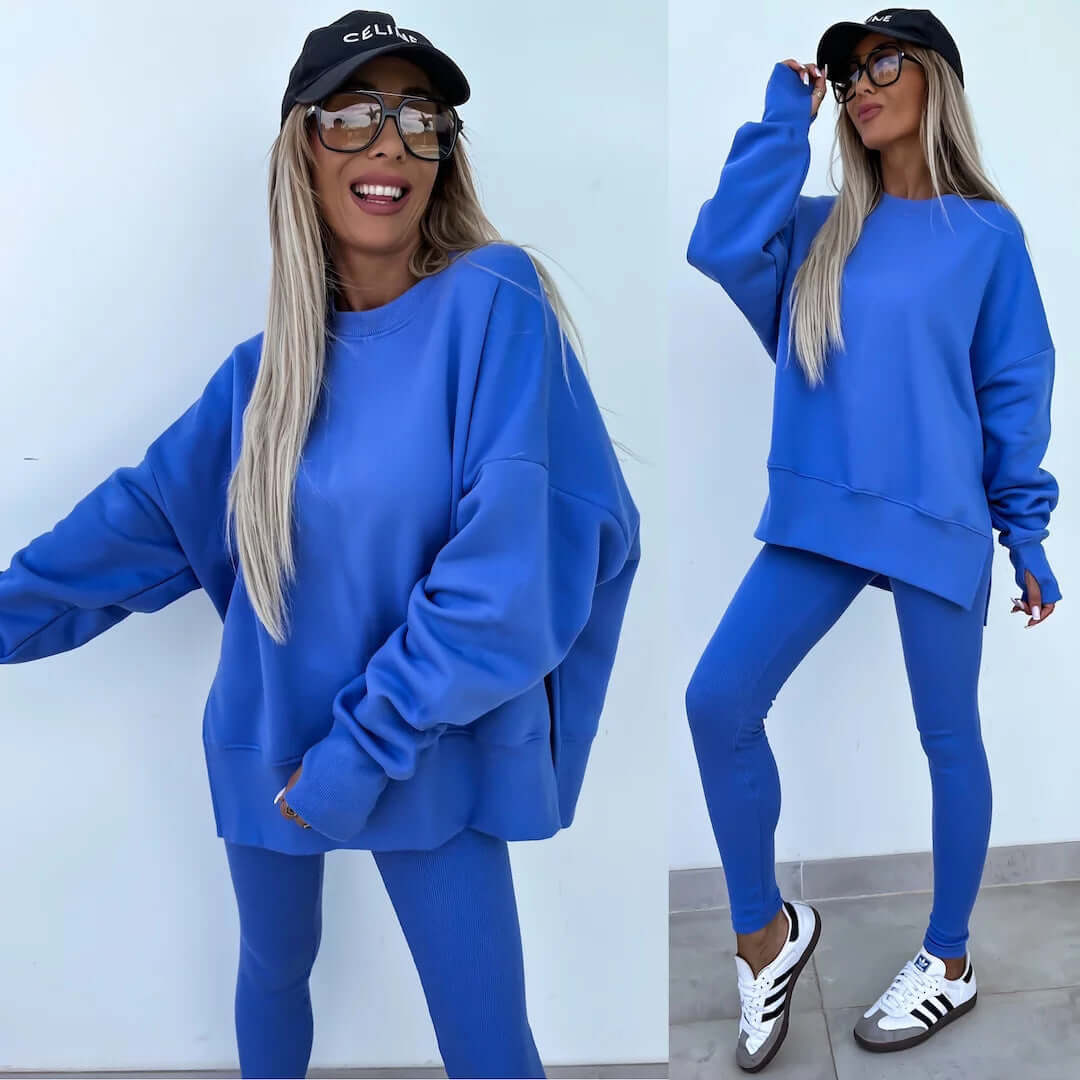 Women's casual loose long sleeve crew neck sweater suit in blue, featuring a split top and tight trousers.