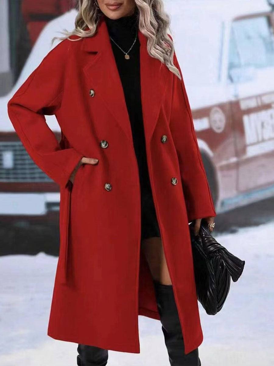 Women's long red double-breasted trench coat with belt and flip collar.