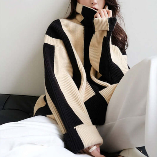 Black and white striped turtleneck pullover sweater with loose fit for women.