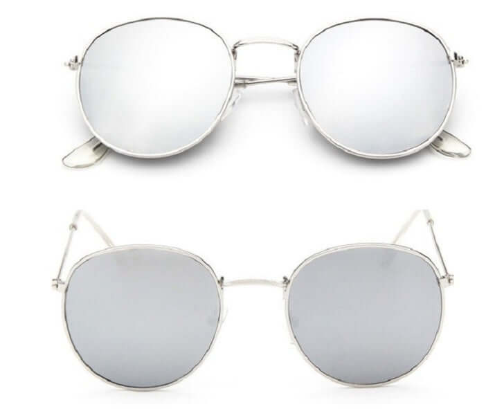 Women Retro Sunglasses with metal frame and round grey lenses in silver color.