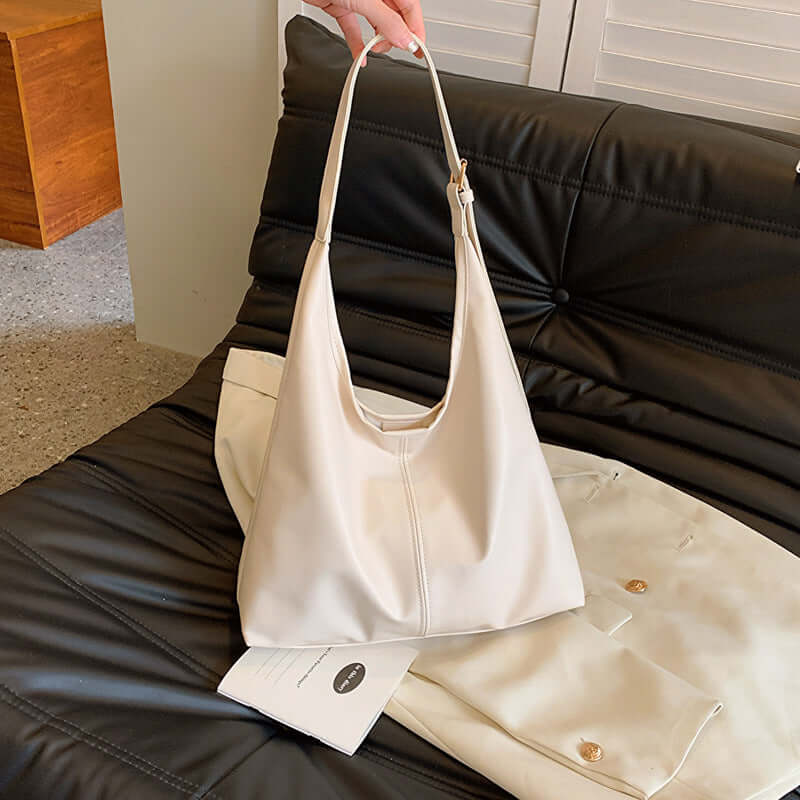 Large white commuter tote for women with synthetic leather lining.