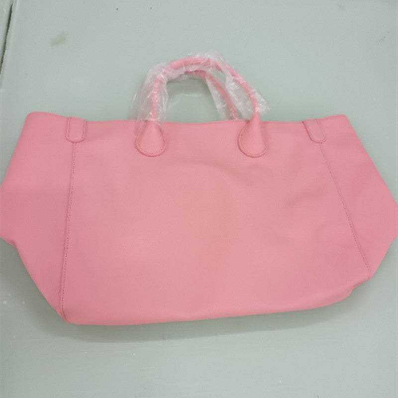 Pink leather ladies tote bag with top layer cowhide and open design.