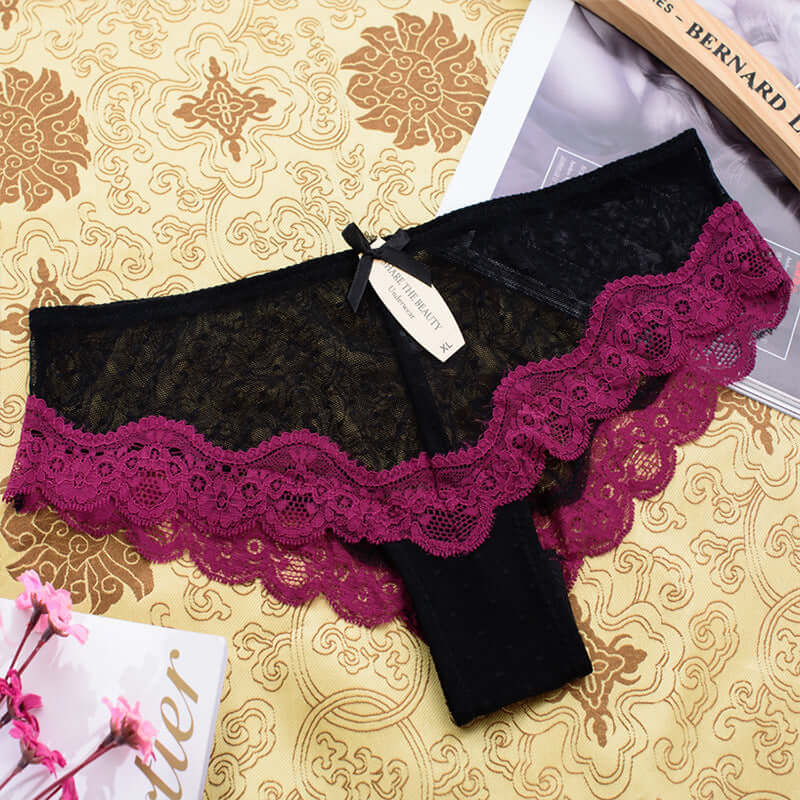 Knitted lace edge low waist ladies' mesh underwear in black with purple lace design.