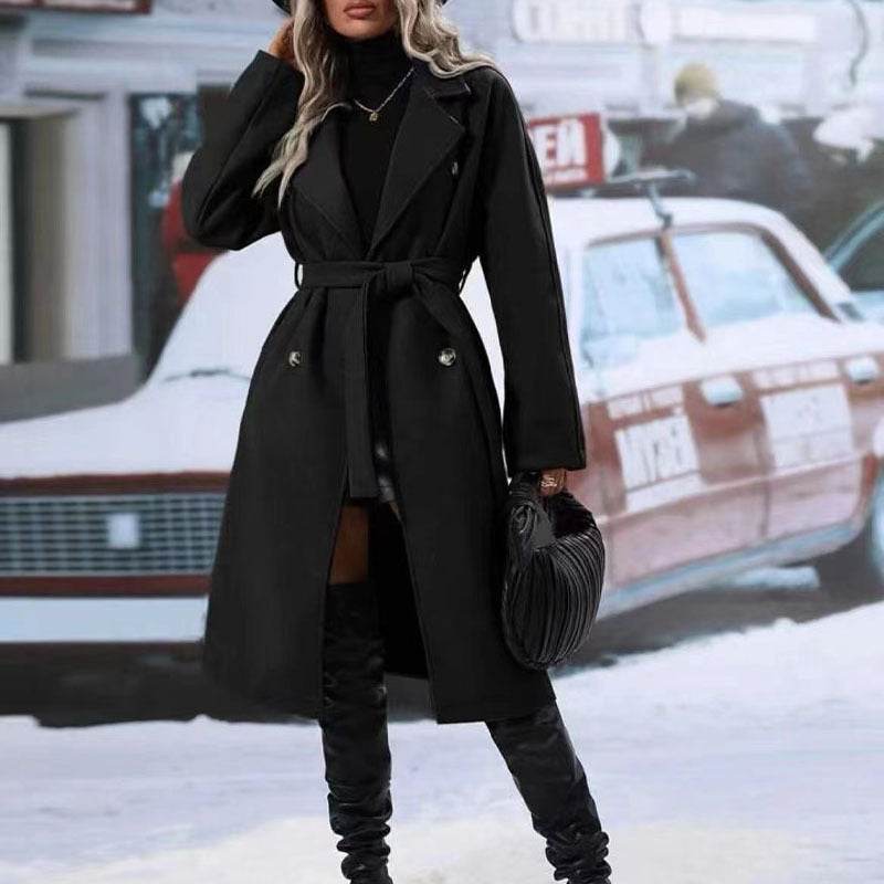 Women's black lapel double-breasted trench coat with belt, long-sleeved winter fashion outwear.