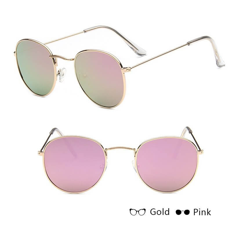 Women retro sunglasses with gold metal frames and pink lenses.