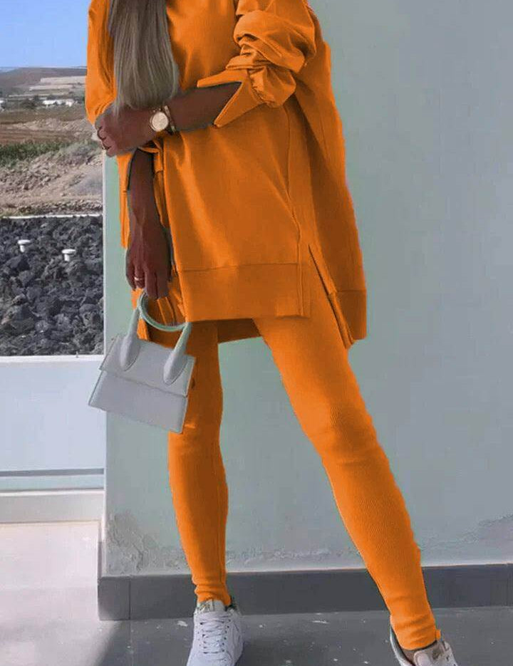 Women's casual hooded sweatshirt and tights set in orange with long sleeves.