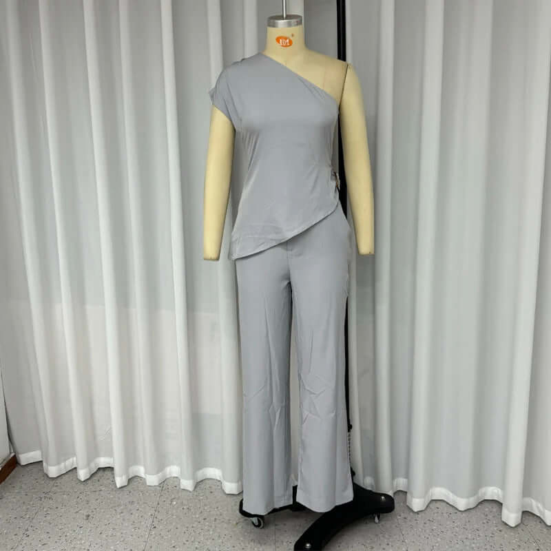 European and American diagonal collar sleeveless top with high waist slim pants in gray, polyester fabric.