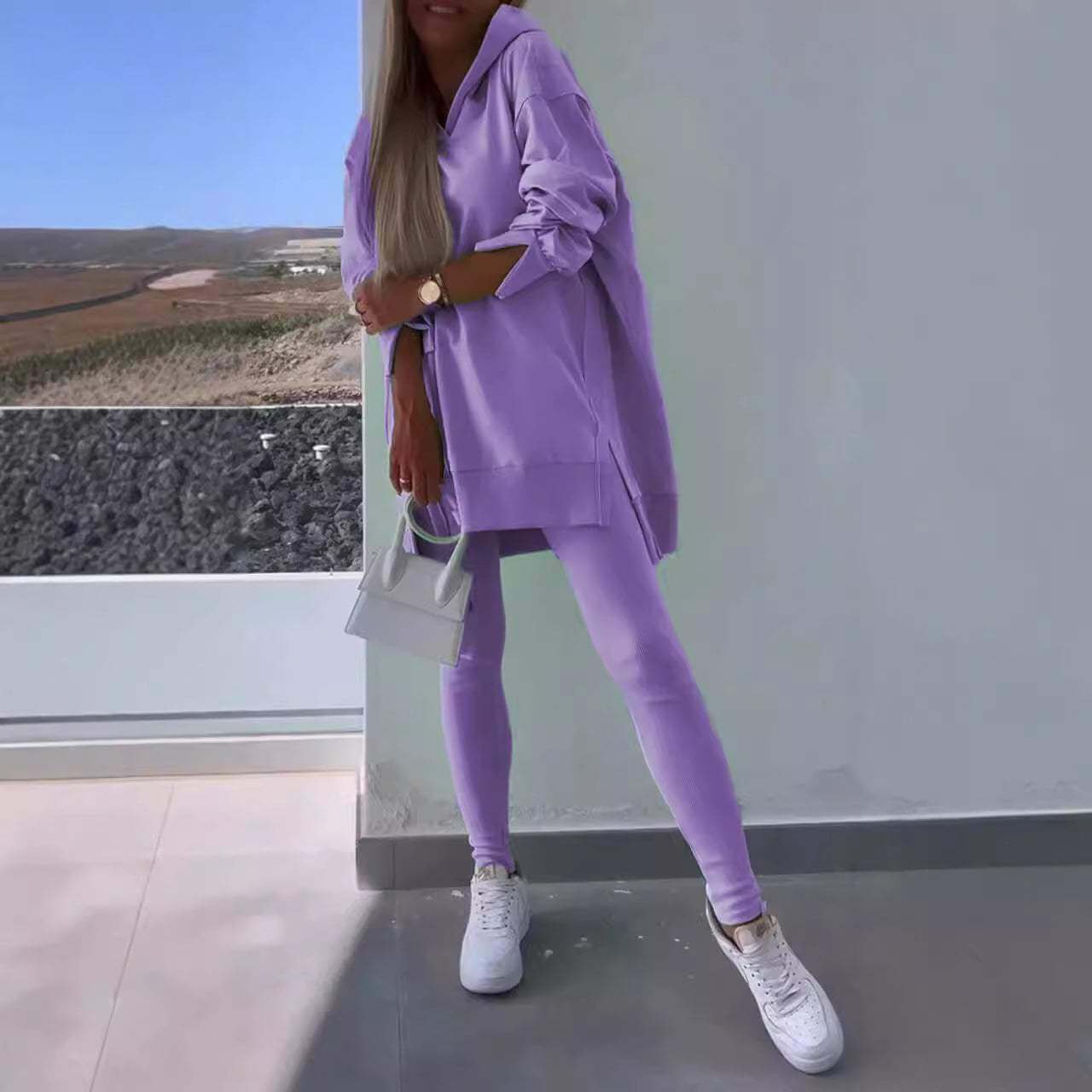 Women's purple hooded sweatshirt and tights two-piece set, casual street style.