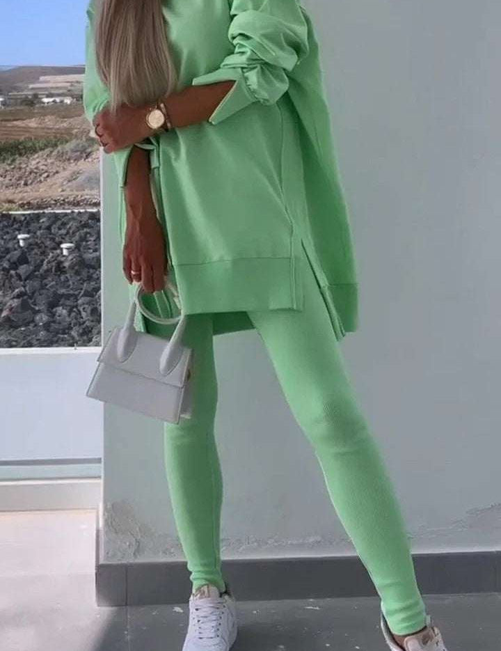 Women's green hooded sweatshirt and tights two-piece set in street fashion style.