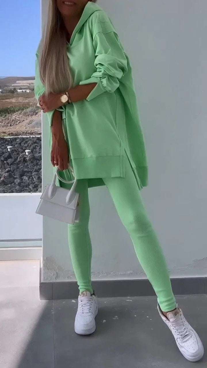 Women's green hooded sweatshirt and tights two-piece set in street fashion style.