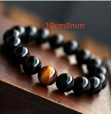 Natural black onyx stone bracelet with tiger eye bead, 19cm length.