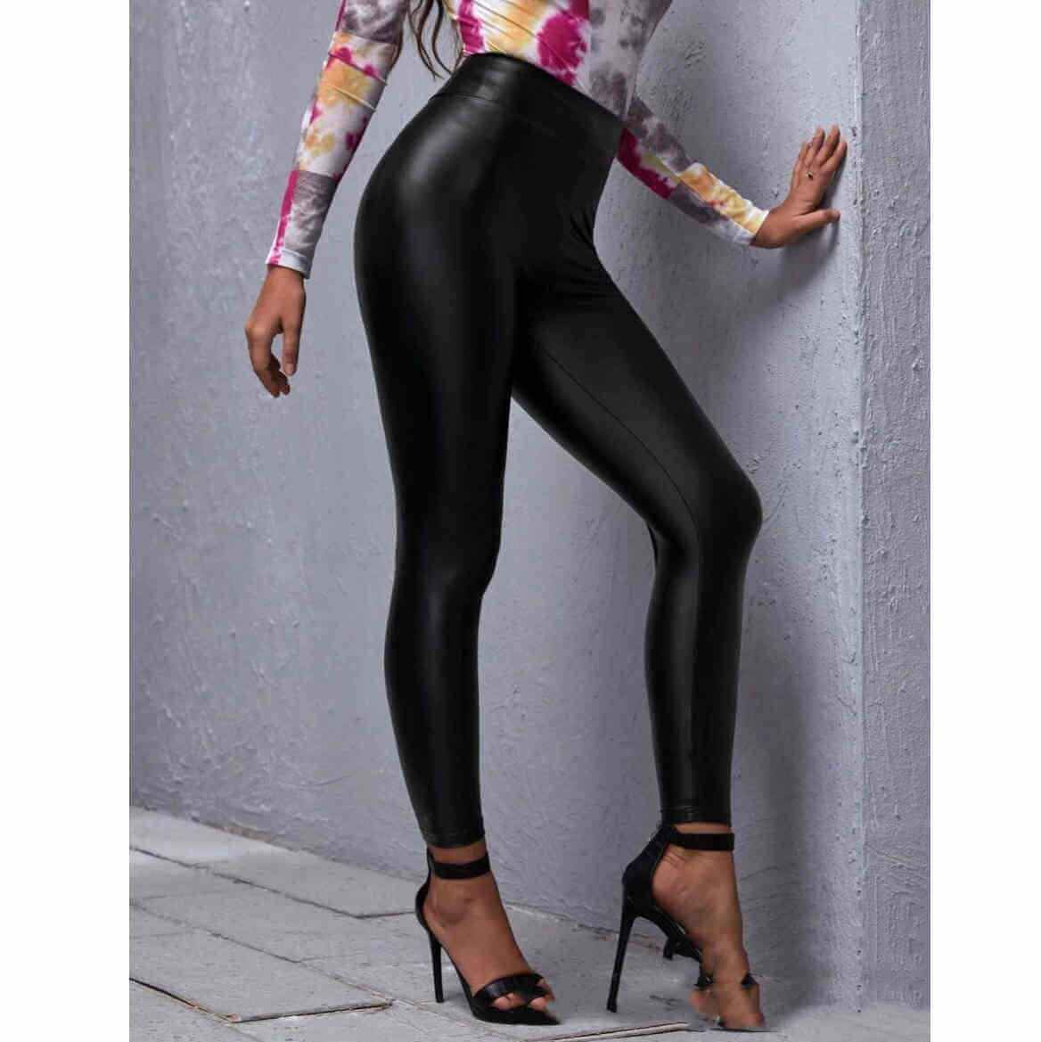 Black mid-waist PU leather pants, tight-fitting silhouette, nine pants length, sexy style for women.