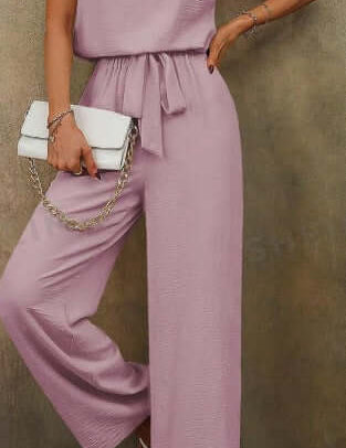 Women solid color sleeveless top with notch neckline and belted long pants set in pink.