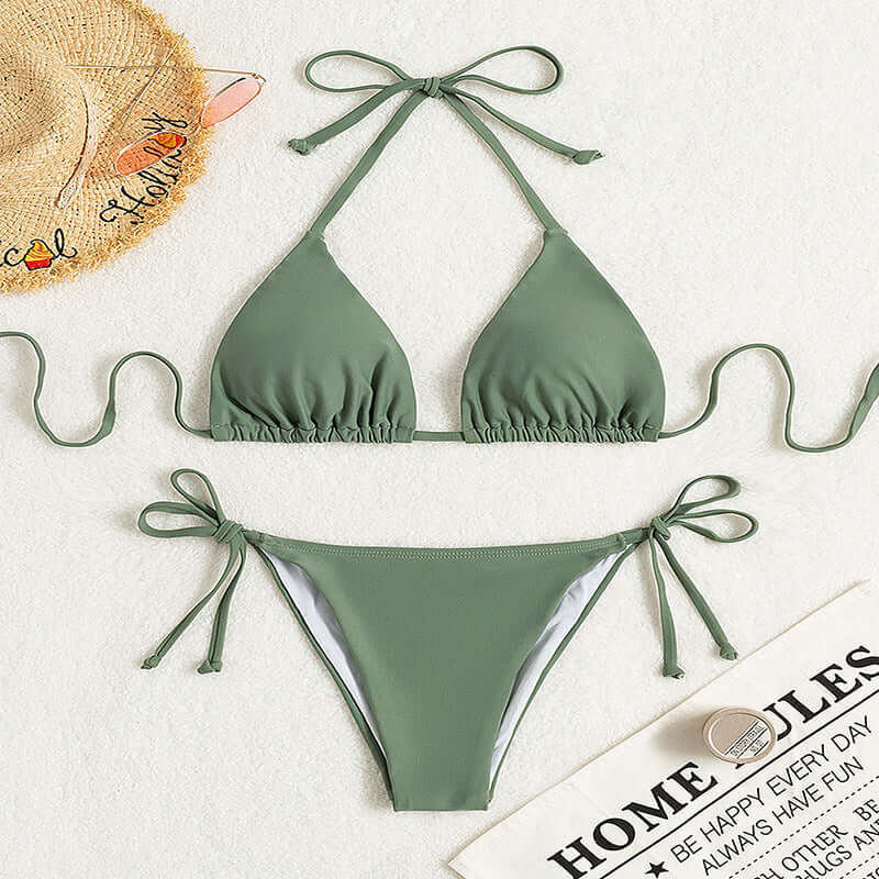 Pure color tied halter bikini swimsuit in green, featuring a solid color design and brief style suitable for females.