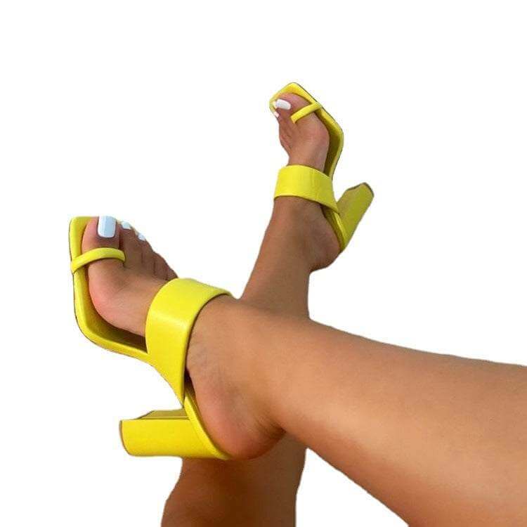 Yellow thick heel sandals with square toe and buckle strap, casual.