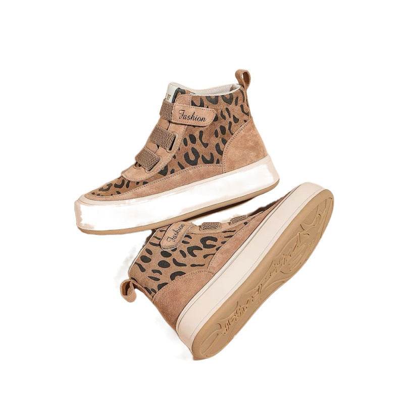 Leopard print high-top platform boots with suede upper and mid heel.