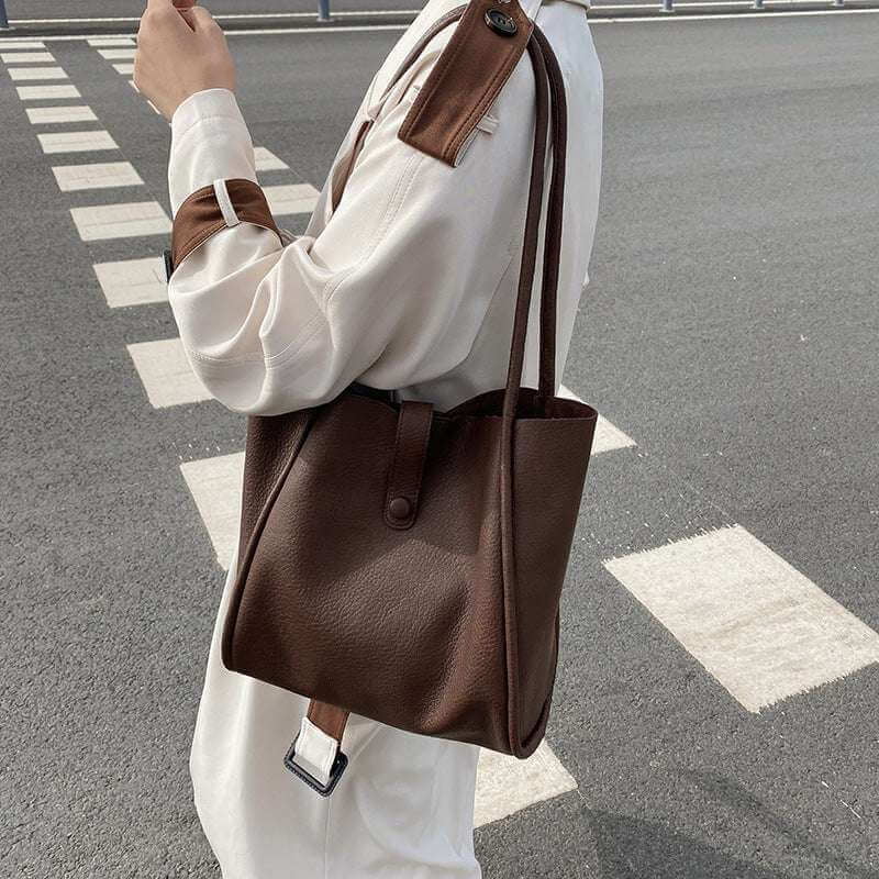 Ladies fashion casual street trend party bag in brown PU material, urban simplicity design.