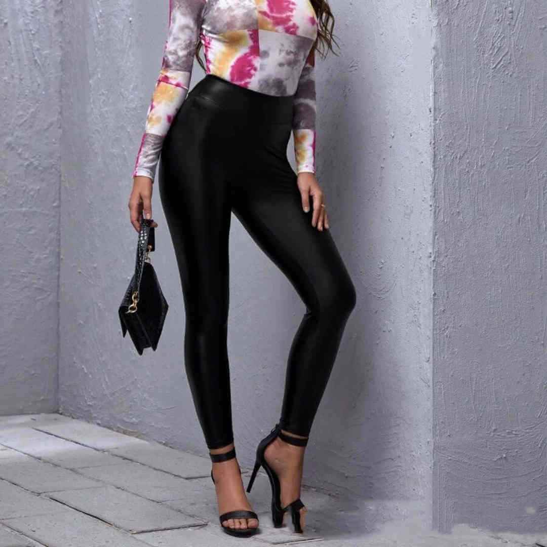 Black PU leather slim tight-fitting mid-waist pants for women, showcasing a sexy and flattering fit.