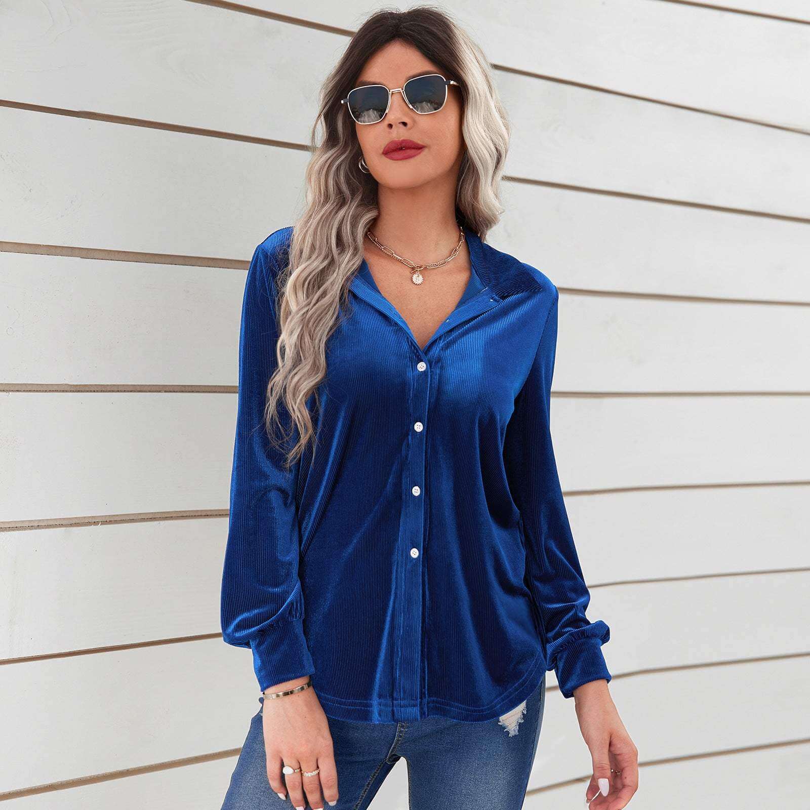 Ladies royal blue velvet striped shirt with lapel collar and long sleeves.