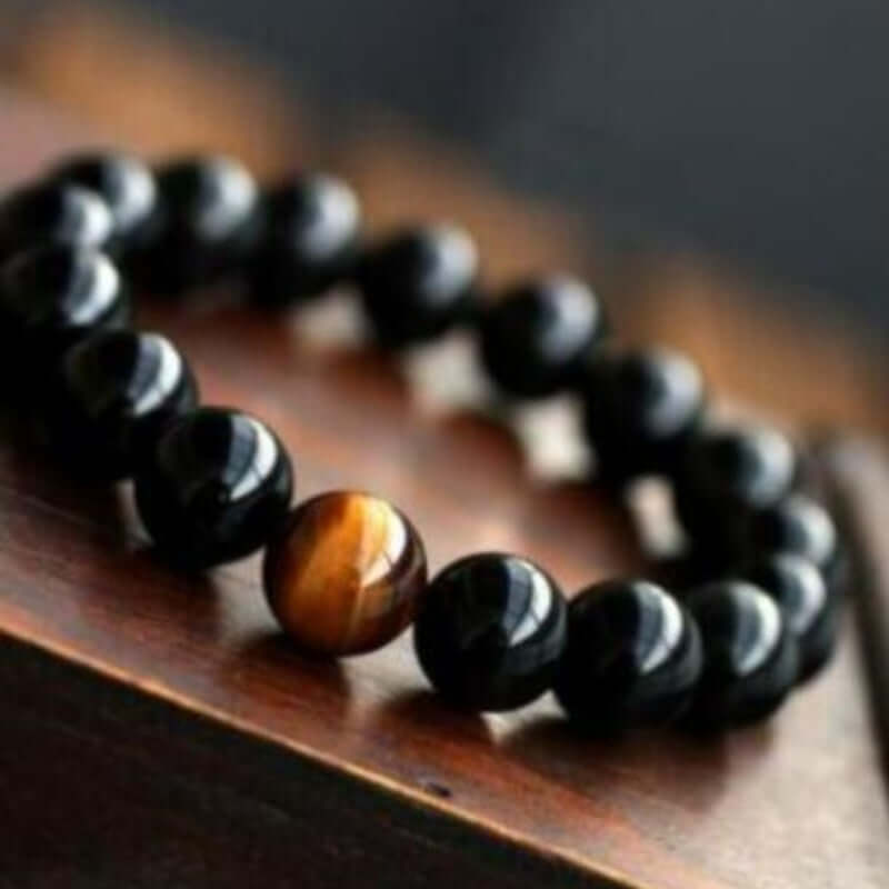 Natural black onyx bracelet with tiger eye stone beads for energy.